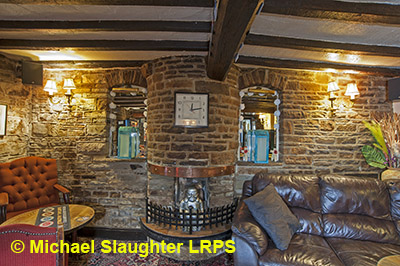 Fireplace in rear left room.  by Michael Slaughter. Published on 